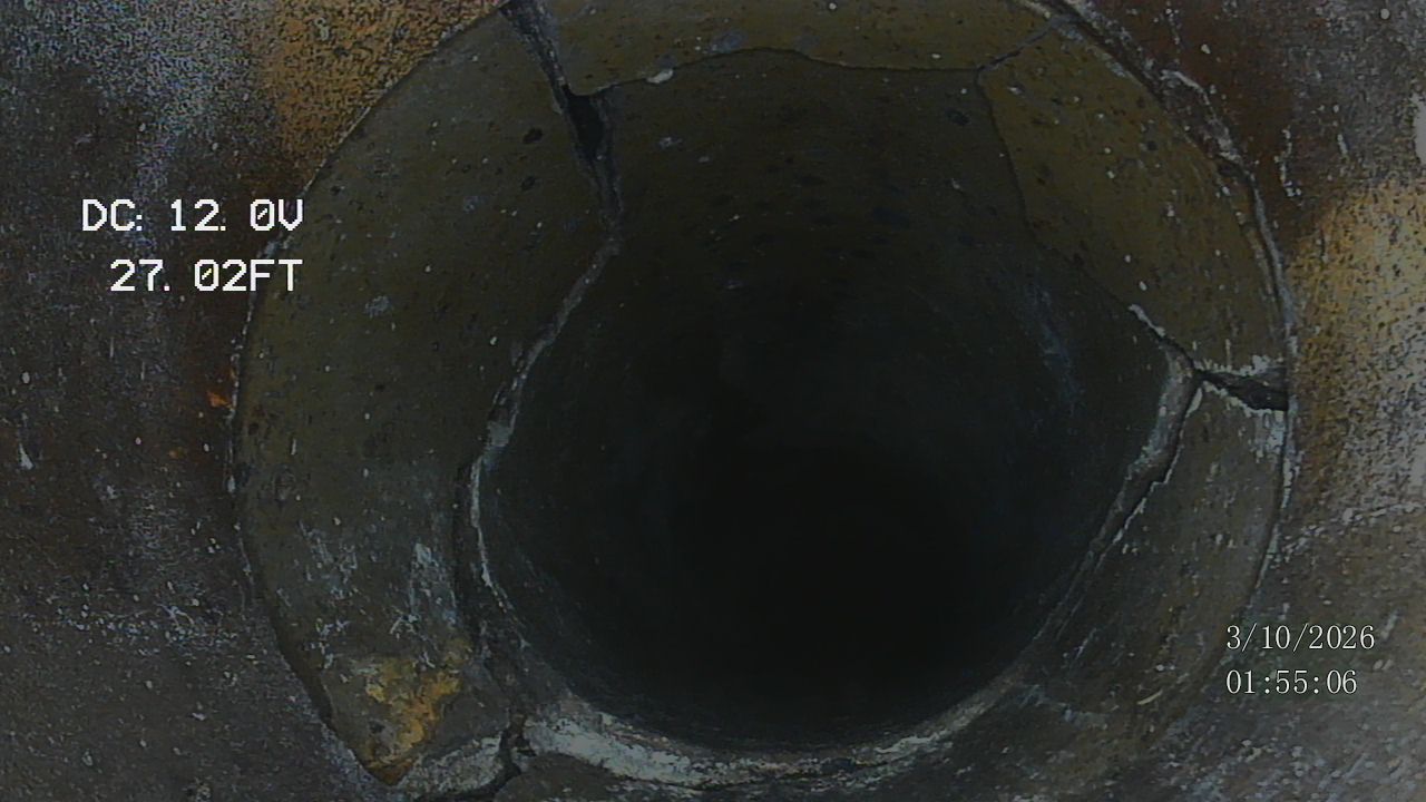 Sewer camera inspection footage showing cracked pipe interior at 27 feet
